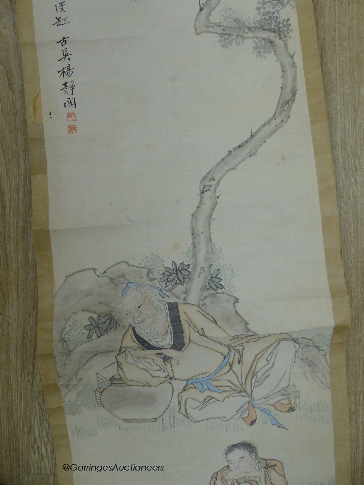 An early 20th century Chinese scroll painting on paper and scholar and boy